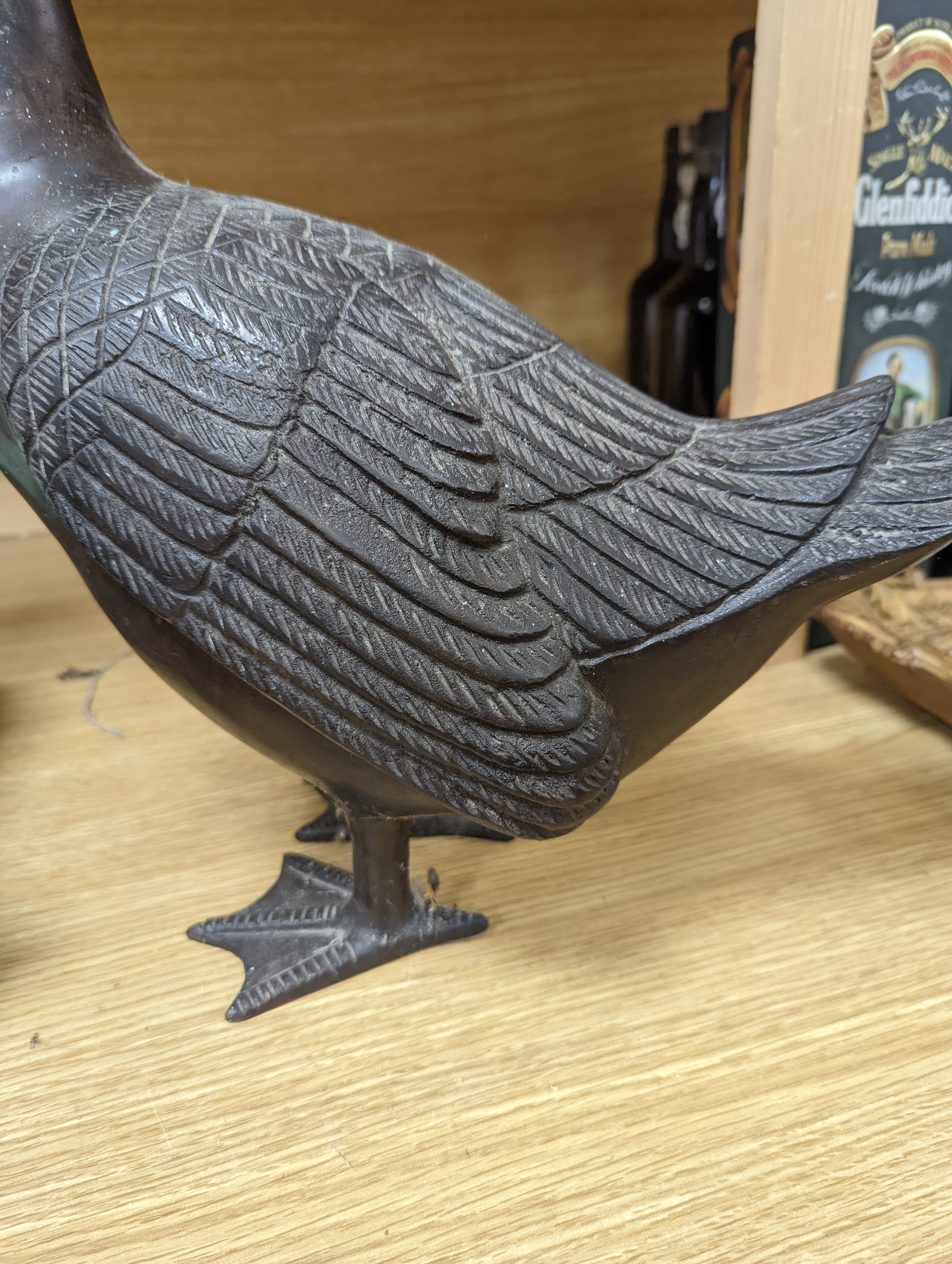 A pair of modern Chinese bronze models of geese, largest 48cm